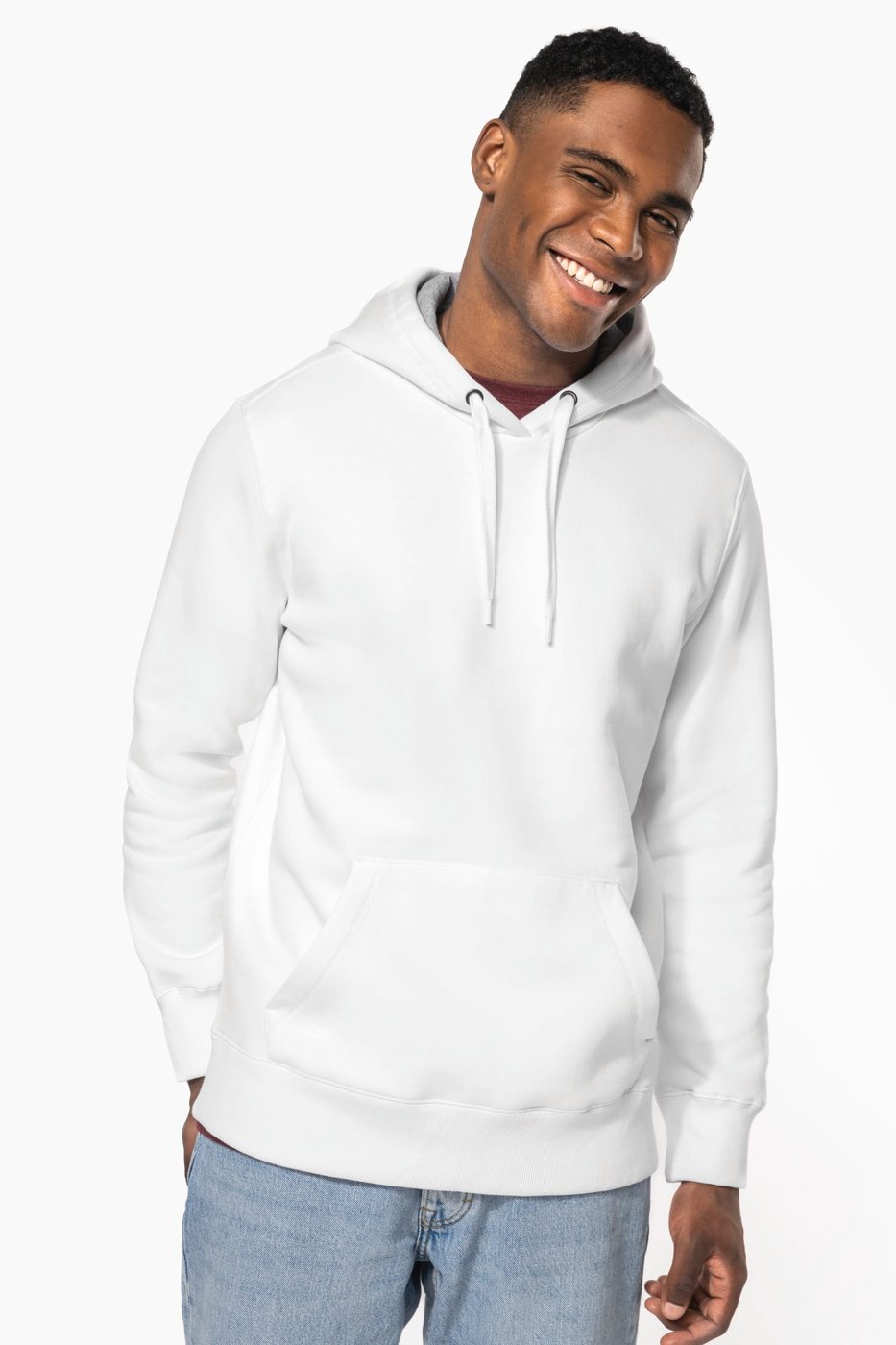 Smiling man in a white hoodie with jeans