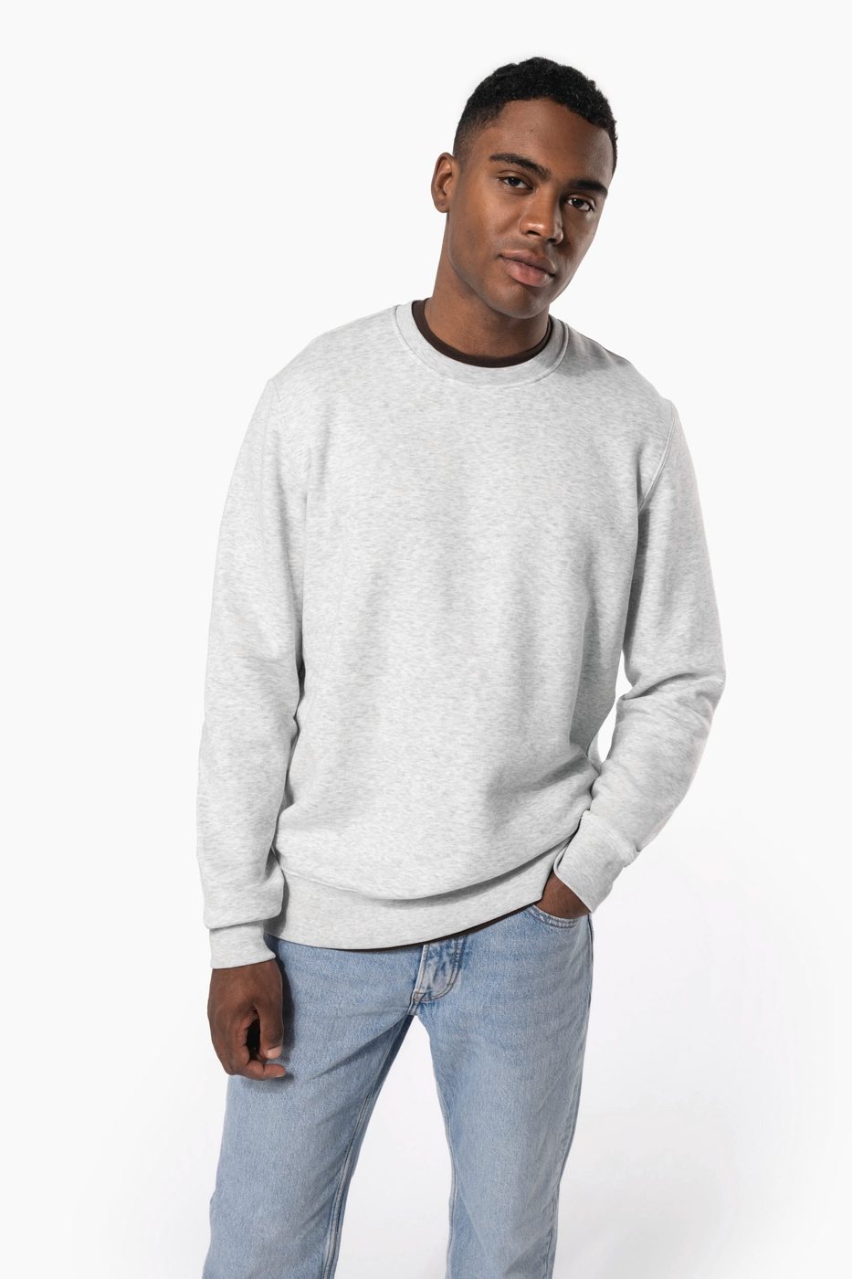 Man in a light grey marl crewneck sweater