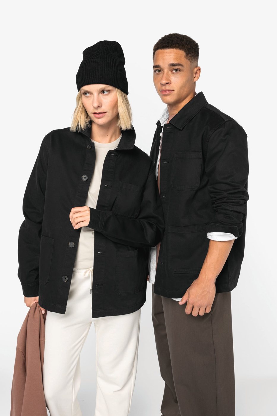 Woman and man in a black workerjack