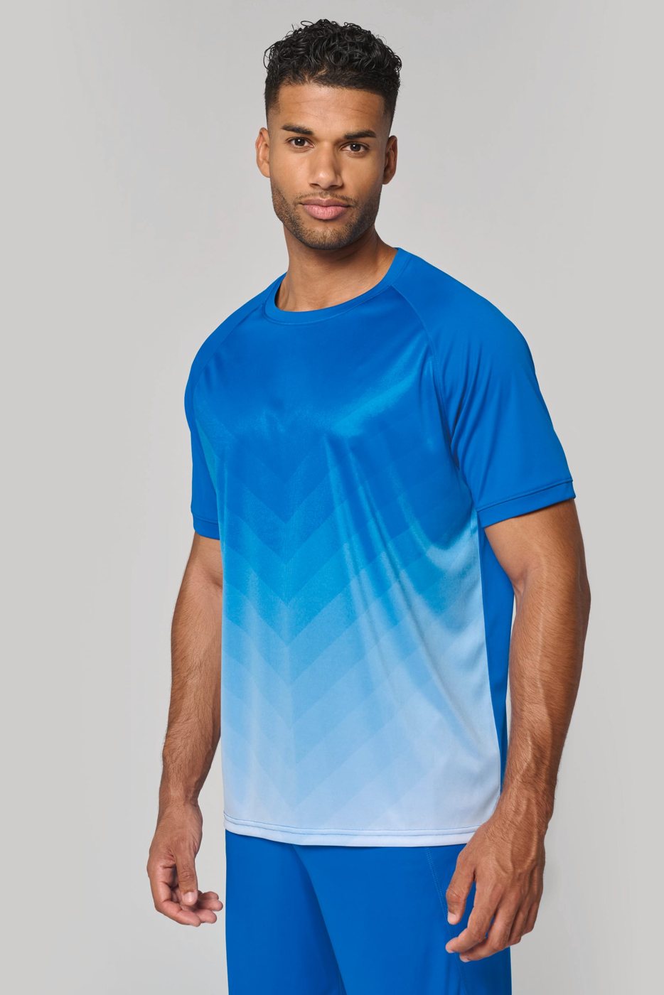Man in a blue sports shirt fading to white