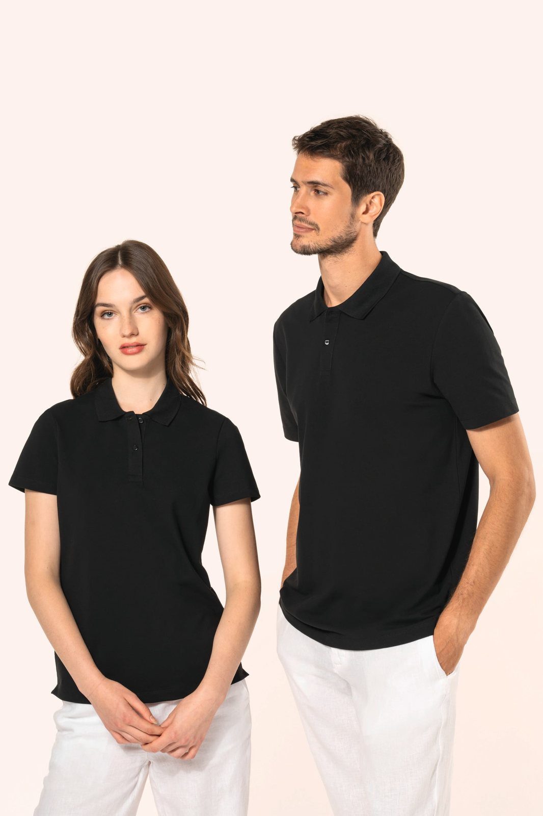 Woman and man in a black polo shirt with white trousers