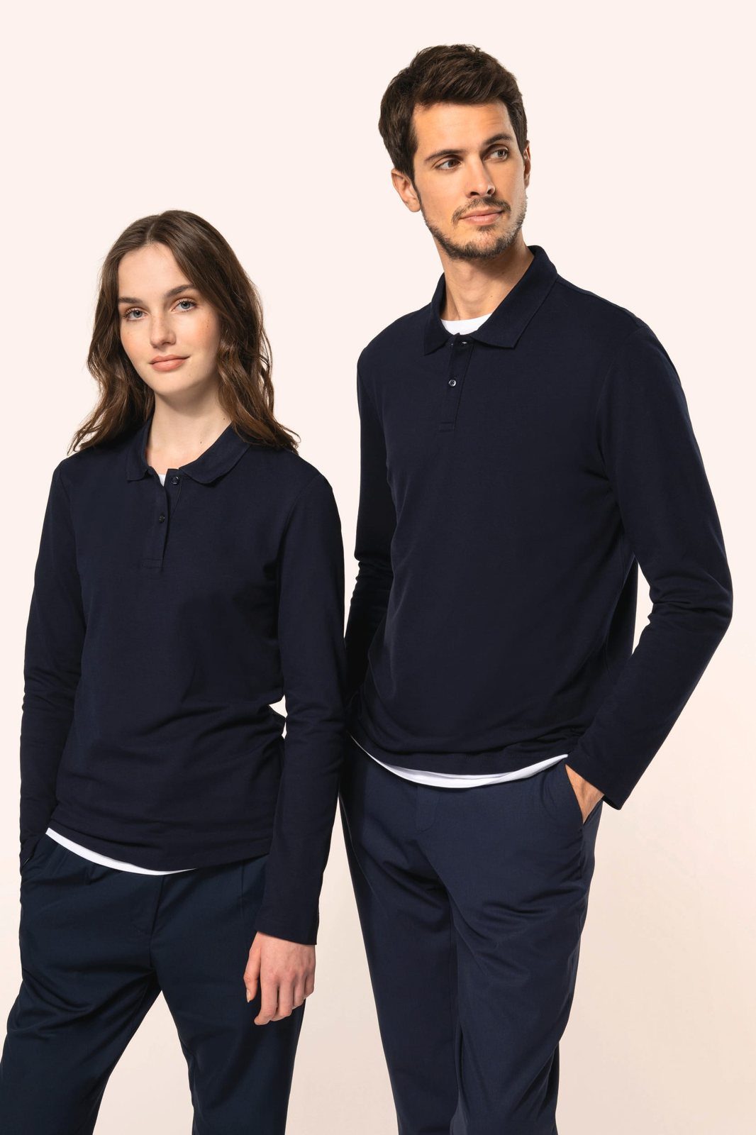 Woman and man in a navy blue polo with long sleeves