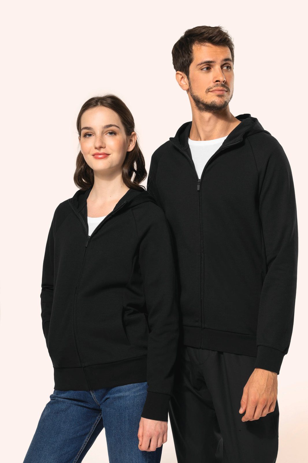 Woman and man in a black jacket with zip and hood