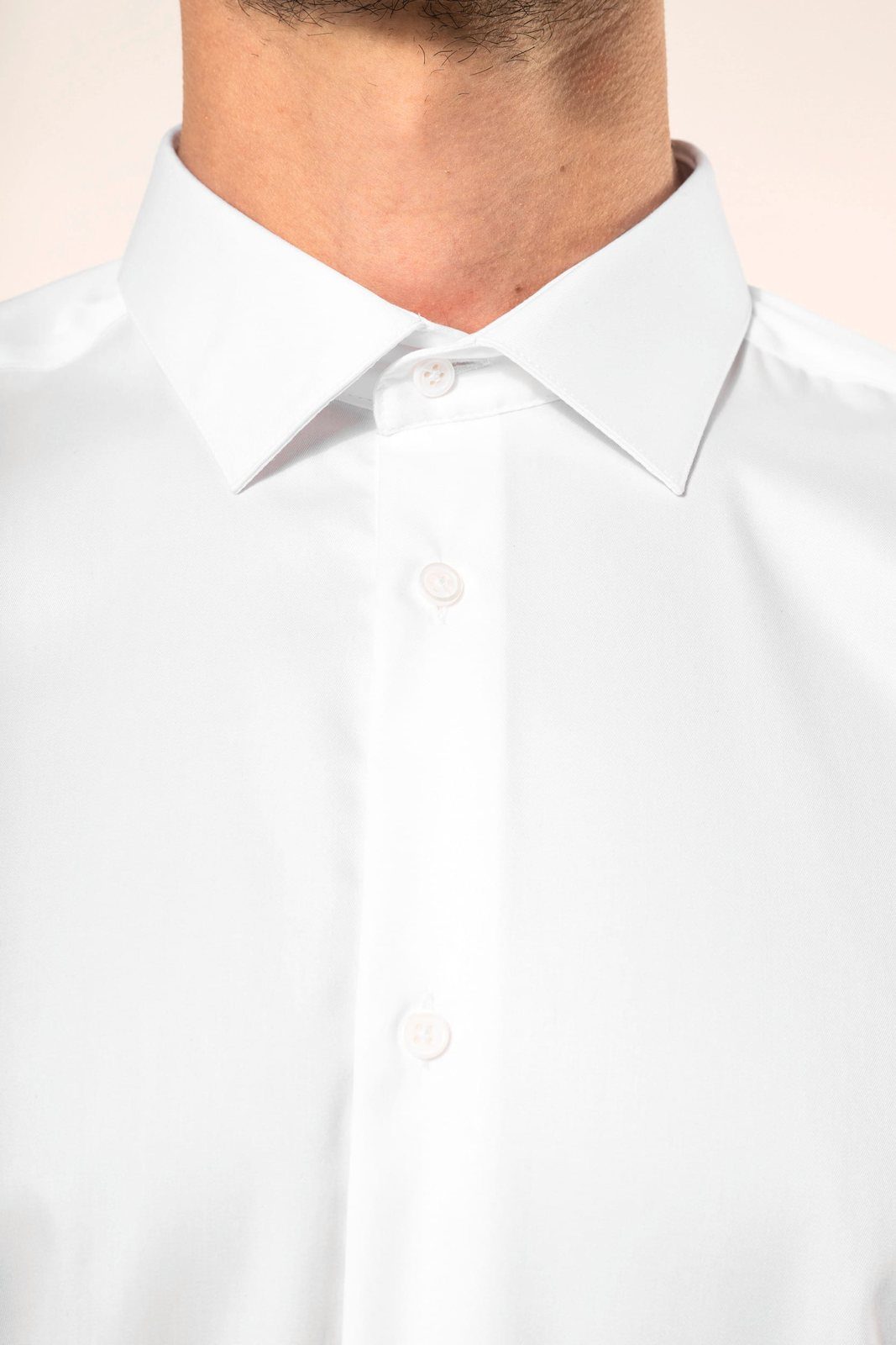 Close-up of the collar of a white twill shirt