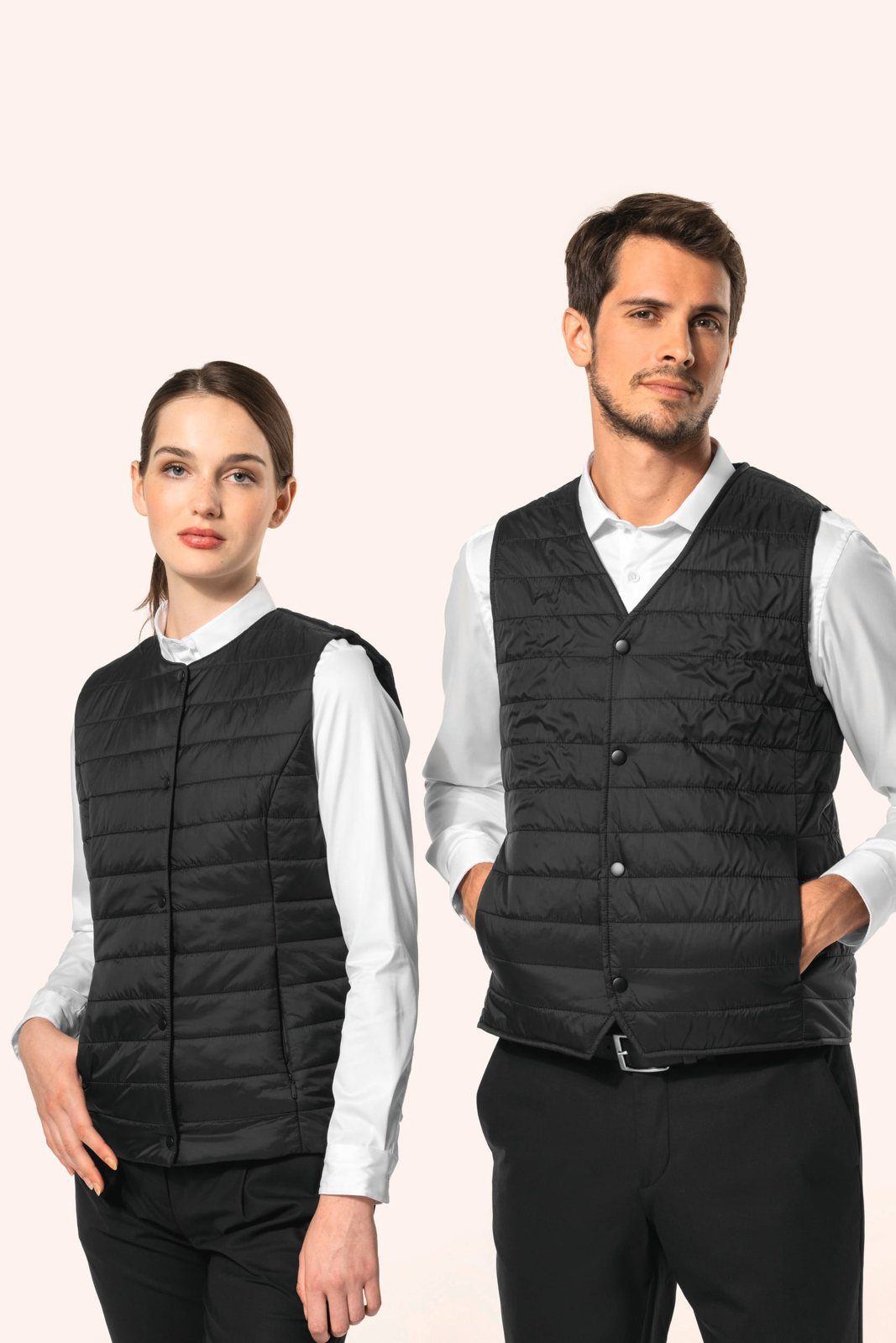 Woman and man in a black lightweight bodywarmer over a white shirt