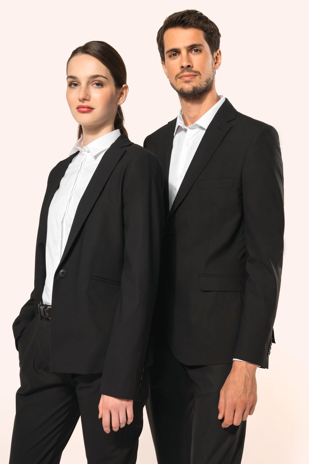 Woman and man in a black blazer and trousers with a white shirt