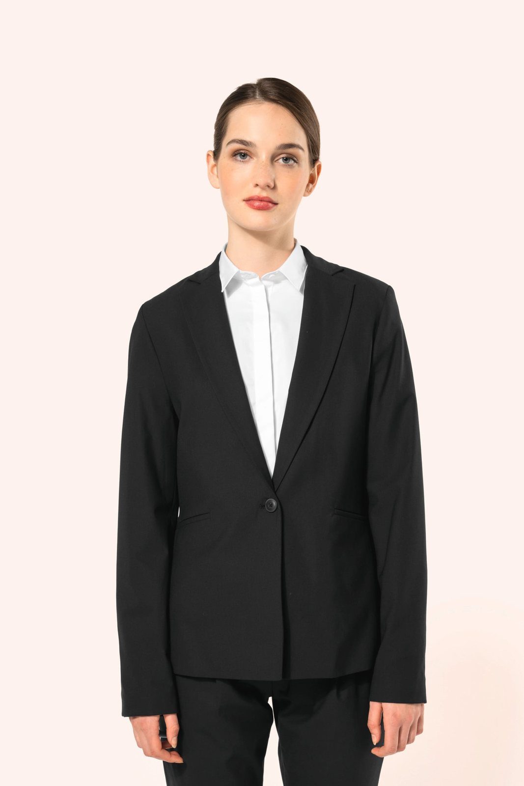 Woman in a black women's blazer with a white shirt