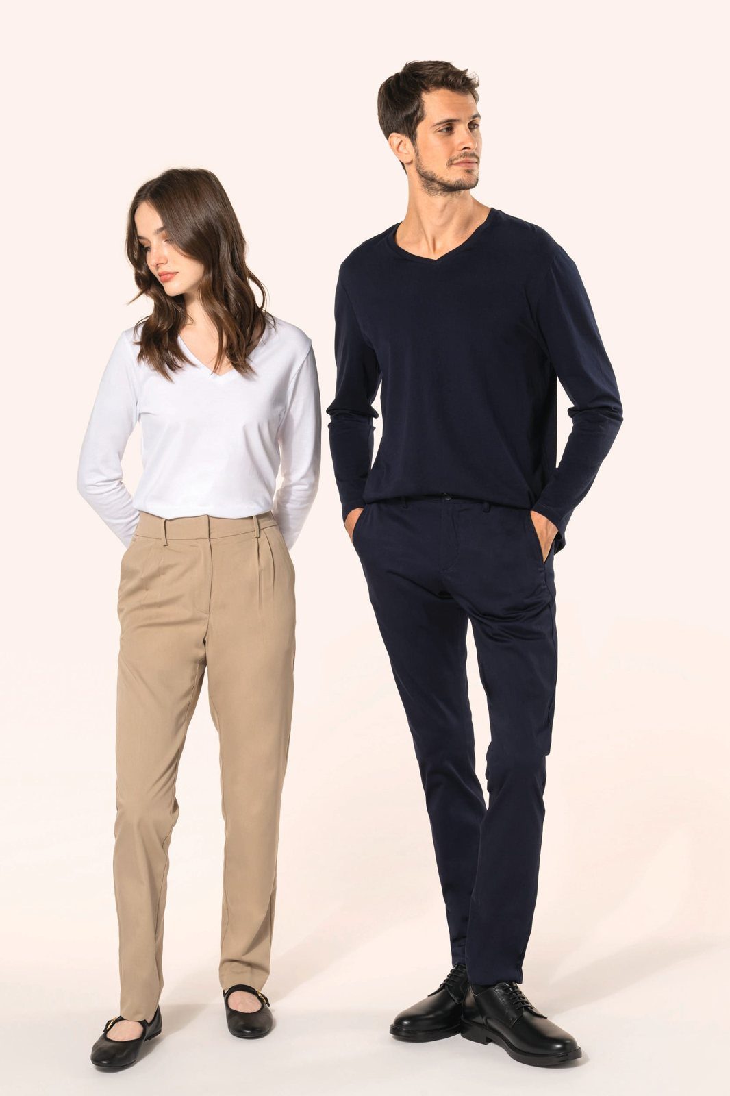 Woman in beige trousers and man in a navy chino
