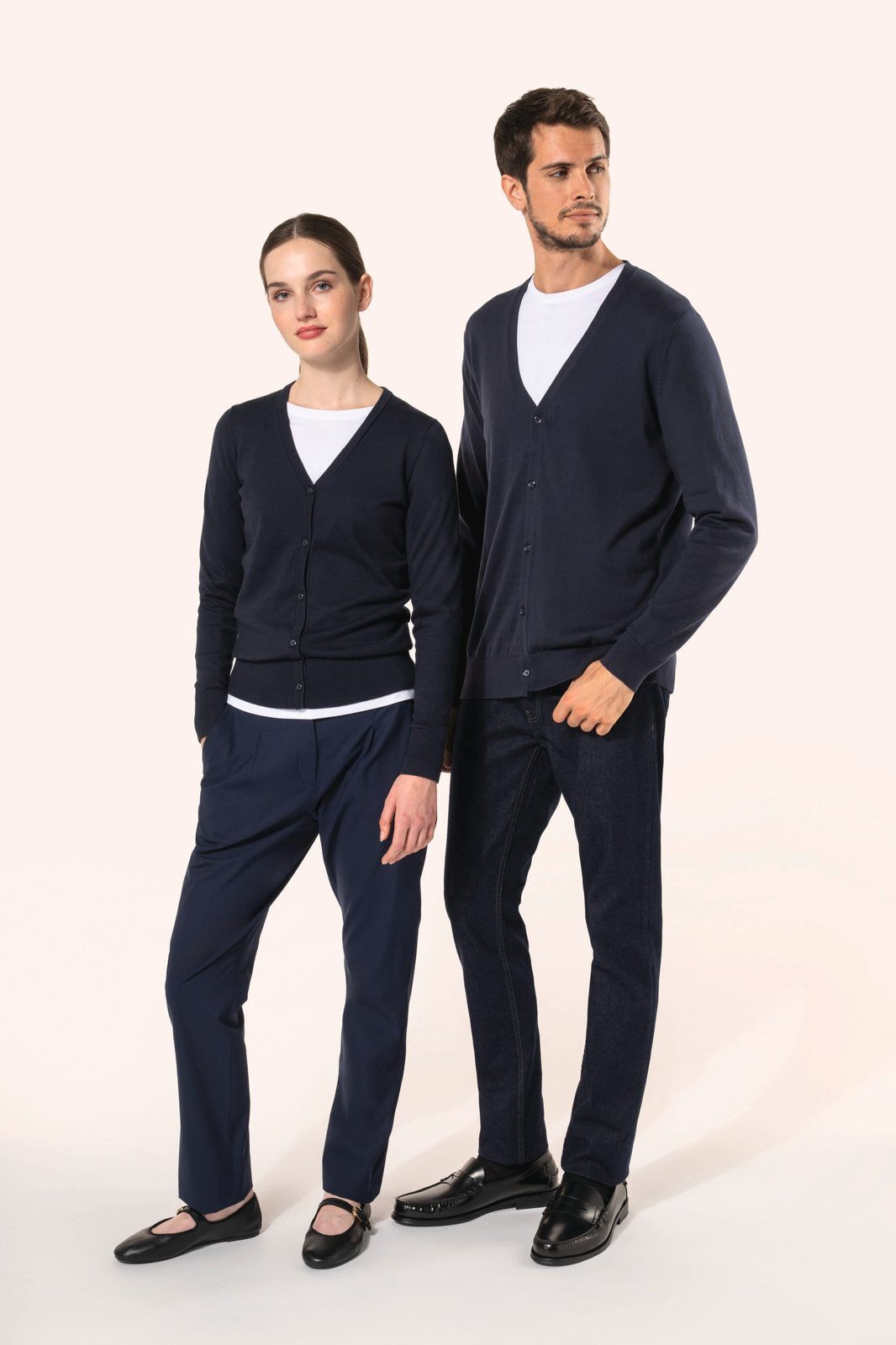 Woman and man in a dark navy jumper and dark navy trousers