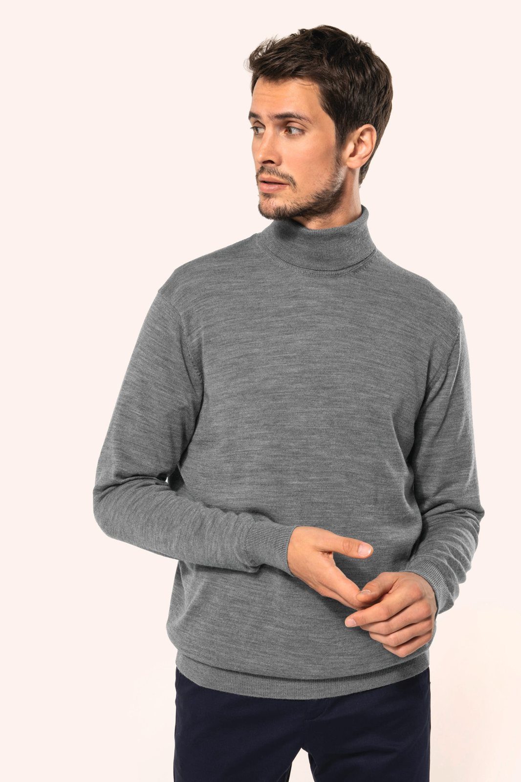 Man in a grey merino jumper with a roll neck